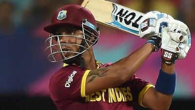West Indies batsman Lendl Simmons plays a shot during the World T20 cricket tournament semi-final match between India and West Indies at The Wankhede Cricket Stadium in Mumbai on March 31, 2016. / AFP / PUNIT PARANJPE