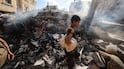 A boy stands in the rubble of a residential building hit by an Israeli strike in Gaza. AFP.