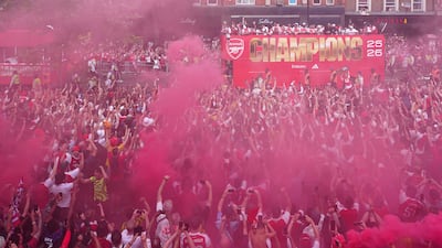 Arsenal team members during the victory parade on Holloway Road. PA