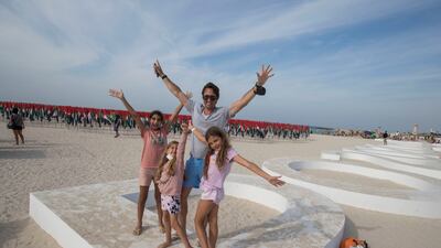Nicolas Bruylants with his children spend the National Day holiday at Kite Beach in Dubai. Ruel Pableo for The National