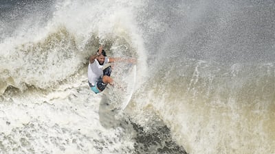 Italo Ferreira competes in the men's final of the surfing competition.