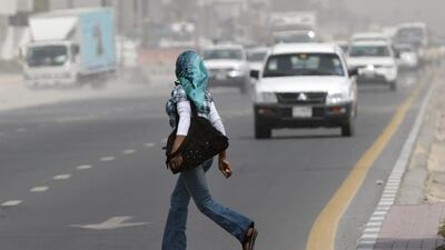 A jaywalker crosses the road near Mall of the Emirates. Pedestrians are ignoring warnings from police about jaywalking. Jaime Puebla / The National