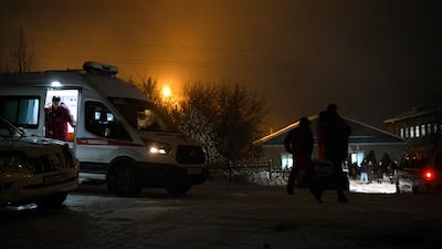 An ambulance is parked at the Listvyazhnaya coal mine in Russia's Kemerovo region as rescuers try to locate missing miners on November 25. AFP