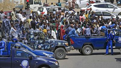 Sudanese rescue teams and security forces gather next to damaged vehicles at the site of an assassination attempt against Sudan's Prime Minister Abdalla Hamdok, who survived the attack with explosives unharmed, in the capital Khartoum. AFP