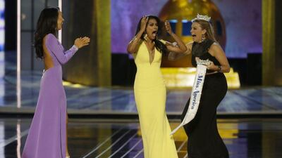 Miss America 2013 Mallory Hagan, right, was denigrated by comments by officials running the competition. AP Photo/Mel Evans
