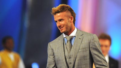 David Beckham, with a new mohawk and checked three-piece suit, attends the Soccer World Cup Final Draw at the CTICC on December 4, 2009 in Cape Town, South Africa. Getty Images