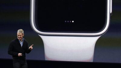 Apple CEO Tim Cook explains the features of the new Apple Watch. Phone calls can be answered on the watch and notifications received. Eric Risberg / AP Photo