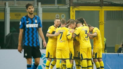 Gervinho is mobbed by his Parma teammates after scoring their second goal. Reuters
