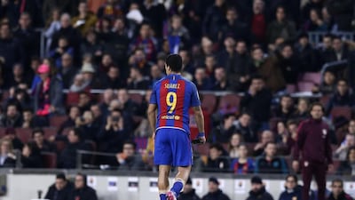 Barcelona's Luis Suarez leaves the pitch after being shown a red card. Manu Fernandez / AP