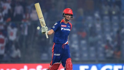 Delhi Daredevils batsman Chris Morris celebrates scoring a half-century (50 runs) during the 2016 Indian Premier League (IPL) Twenty20 (T20) cricket match between Delhi Daredevils and Gujarat Lions at The Feroz Shah Kotla Stadium in New Delhi on April 27, 2016. AFP / SAJJAD HUSSAIN