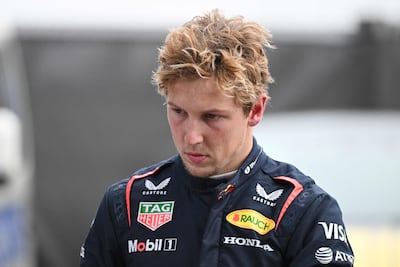 Liam Lawson walks back to the Red Bull garage after his 16th place finish at the Chinese GP. AFP