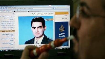 A Jordanian browses a news website showing Homam Khaleel Mohammad Abu Mallal, a suicide bomber who killed seven CIA officers. Abu Mallal was reportedly recruited by Jordanian intelligence to infiltrate al Qa'eda and provide information for the US.