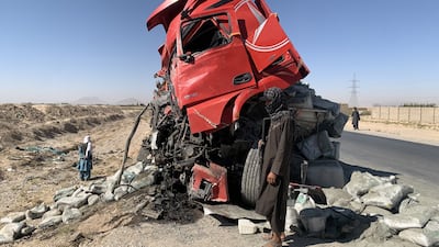 The wreckage of a lorry sits on a roadside embankment after a collision with a passenger bus that killed five and injured 16 in Kandahar, Afghanistan. EPA