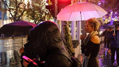 Ma Yinhong walking along a street in downtown Shanghai. AFP