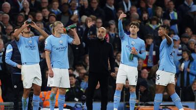 Manchester City manager Pep Guardiola with his players during the win against Arsenal. Reuters