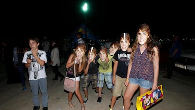 Fans of Canadian singer Justin Bieber mask up at Sevens Stadium in Dubai in May 2013. Sarah Dea/The National