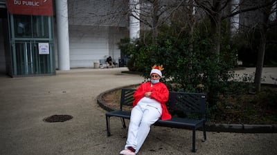 An emergency room nurse takes a break while working on Christmas day at a hospital in Marseille, southern France, amid a surge in Omicron cases. AP Photo