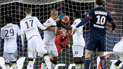 Zlatan Ibrahimovic scores during PSG's win on Saturday. Franck Fife / AFP