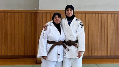 Maryam Al Dhanhani with a teammate in Tokyo last year poses under a photographer of Kano Jigoro, the founder of judo. Photo: Mouh Al Mouh