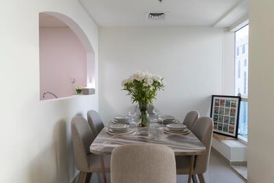 The light and bright dining area at the two-bedroom JLT apartment. Antonie Robertson / The National