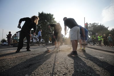 Volunteers cleaning up after the rioting in Southport. PA
