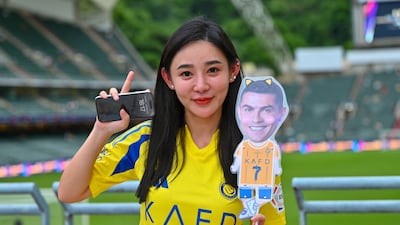 A local fan who came out to support Cristiano Ronaldo in Hong Kong. AFP