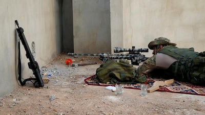A member of the Iraqi security force aims at targets during clashes with Islamic State militants.