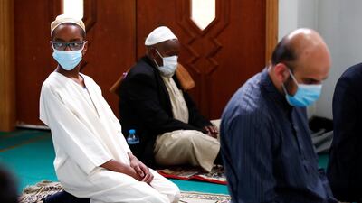 Worshippers wear face masks while they attend Eid Al Fitr prayers at Didsbury Central mosque in Manchester. Reuters