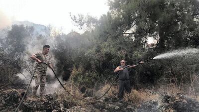 Lebanese army personnel tackle the forest fire. Image @LebarmyOfficial via Twitter