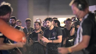 Crown Prince of Dubai, Sheikh Hamdan bin Mohammed, cheers the arriving teams at the finish line on the final day of the Dubai Government Games held at Kite Beach, Dubai. His team, F3, won first place. Reem Mohammed / The National