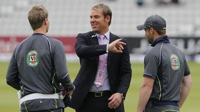 Shane Warne, centre, is Test cricket's second-highest wicket-taker. Ian Kington / AFP