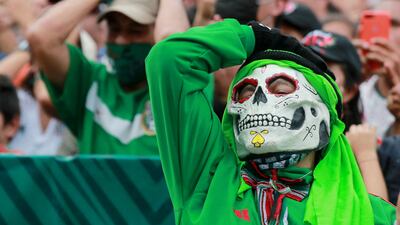 A Mexico fan in Mexico City watches the game against Saudi Arabia. Reuters
