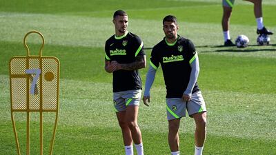 Atletico Madrid's Mario Hermoso, left, and Luis Suarez. AFP