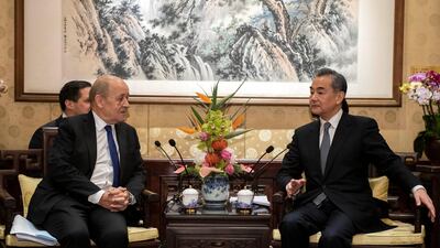 China's Foreign Minister Wang Yi meets for talks with his French counterpart Jean-Yves Le Drian at Diaoyutai State Guesthouse in Beijing, China. Reuters