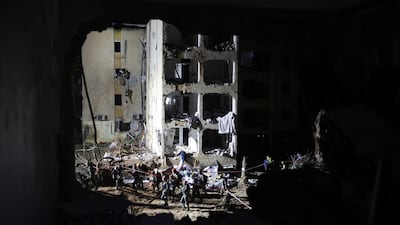 Emergency personnel work at the scene of the strike on Arad. EPA