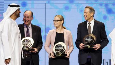 From left: Sultan Al Jaber, Minister of State and Chairman of Masdar, stands with UAE Rain Enhancement Programme award winners Prof Giles Harrison of the University of Reading, Prof Hannele Korhonen of the Finnish meteorological firm FMI, and Dr Paul Lawson of American firm Spec Inc. Christopher Pike / The National