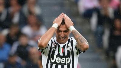 Juventus forward Mario Mandzukic reacts during his side's loss in Serie A on Sunday to Udinese. Marco Bertorello / AFP / August 23, 2015