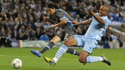 Vincent Kompany, right, could not stop Napoli's Edinson Cavani scoring on City's Champions League debut on Wednesday.