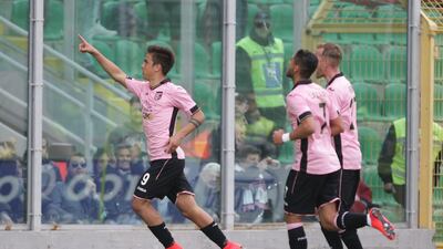 A bidding war is expected to get underway this summer for Palermo forward Paulo Dybala, left. Marcello Paternostro / AFP