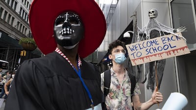 People gather for a protest against plans to reopen schools in the midst of the coronavirus pandemic in New York. EPA