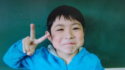 This photo of Yamato Tanooka, 7, was provided by his school. While stranded, he found shelter in a hut and a tap to drink from. AFP