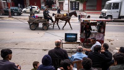Palestinians watch a live broadcast of the World Cup football match between South Korea and Ghana, in the street in Gaza City. AP Photo