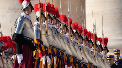 Swiss guards stand at attention. AP