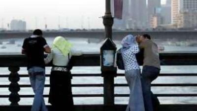 Couples meet on Qasr el-Nil bridge in Cairo. More Egyptian women are prioritising work, sometimes missing out on marriage.