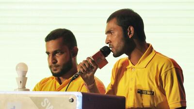 Razak and Kumar sing during the competition.