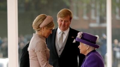 Britain's Queen Elizabeth greets King Willem-Alexander and his wife Queen Maxima of the Netherlands at a Ceremonial Welcome during a state visit. Matt Dunham / AFP