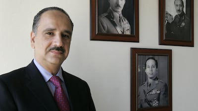 Sherif Ali bin Hussein, great-nephew of Iraq's King Faisal I, poses for a photograph at his house in Baghdad in 2007. Pictures on the background: Iraq's King Ghazi (L), Iraq's King Faisal II (C) and Prince Abdul Illah (R), uncle of King Faisal II. AFP