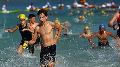 Young Duathletes emerge from the sea to begin their running leg of the Duathlon held in Abu Dhabi today.