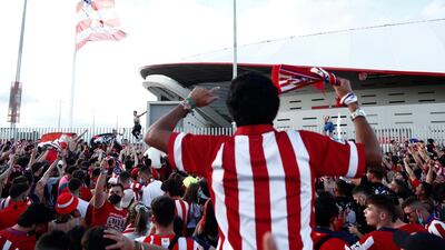Atletico Madrid fans celebrate outside the stadium after the match. Reuters