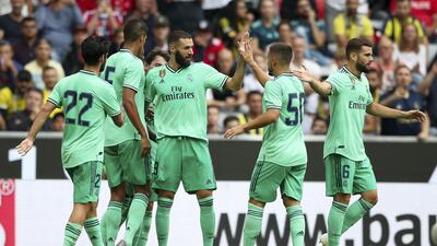 Karim Benzema, centre, scored a hat-trick for Real. Getty